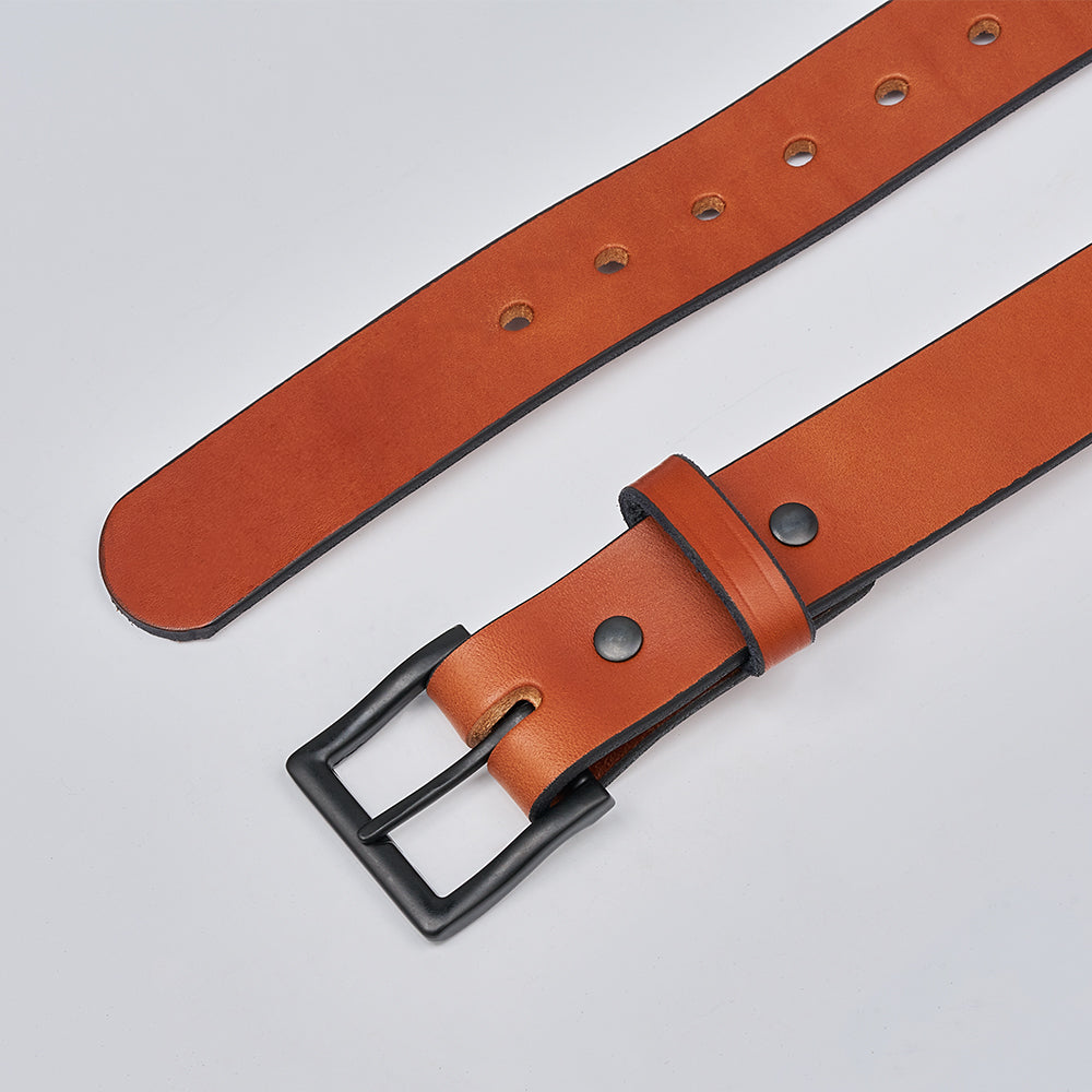 The Everyday by Hanks Belts is a brown full grain leather belt with a matte black metal buckle, multiple adjustment holes, and a matching leather loop, shown laid flat on a light gray background.