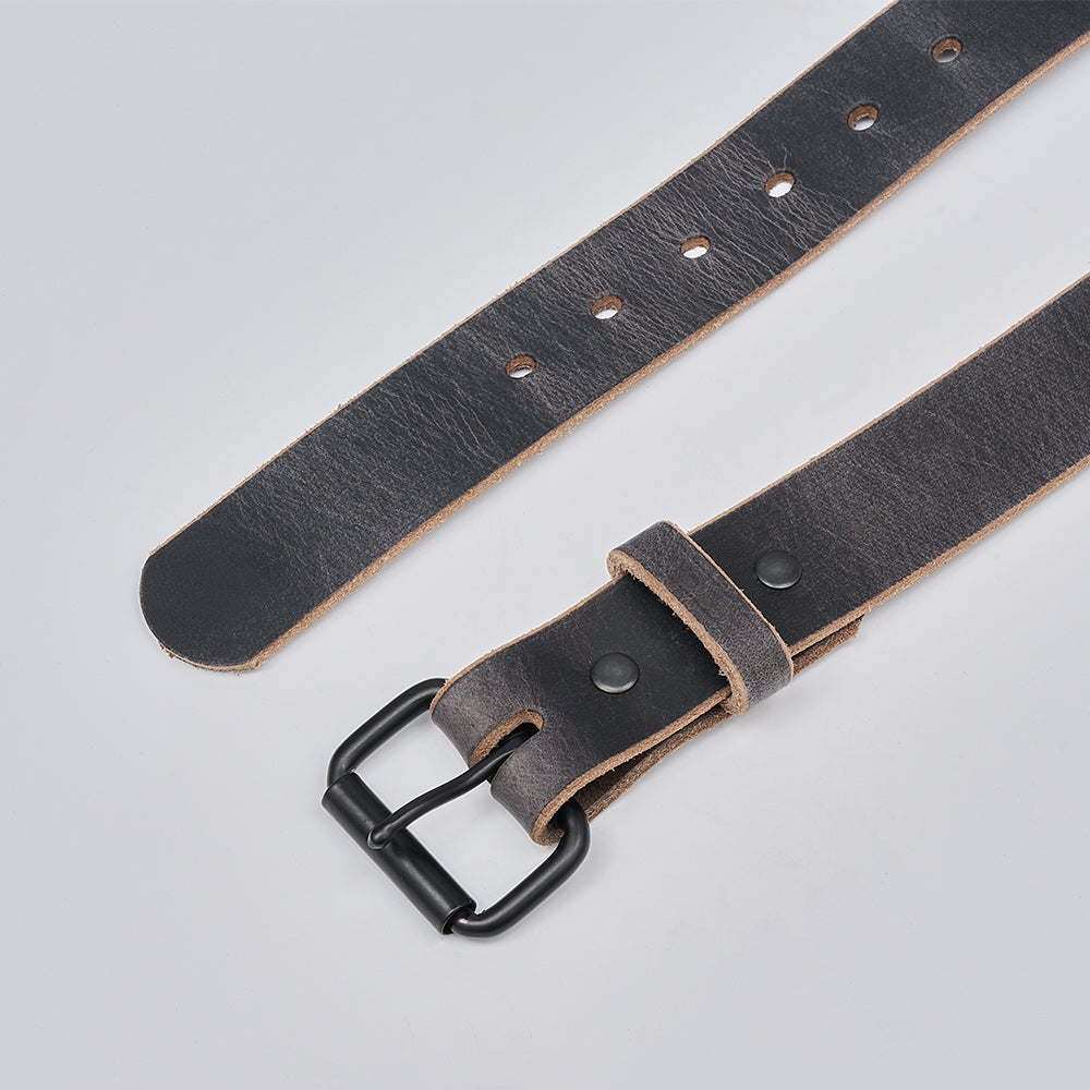 Grey leather belt with black buckle on a light gray background