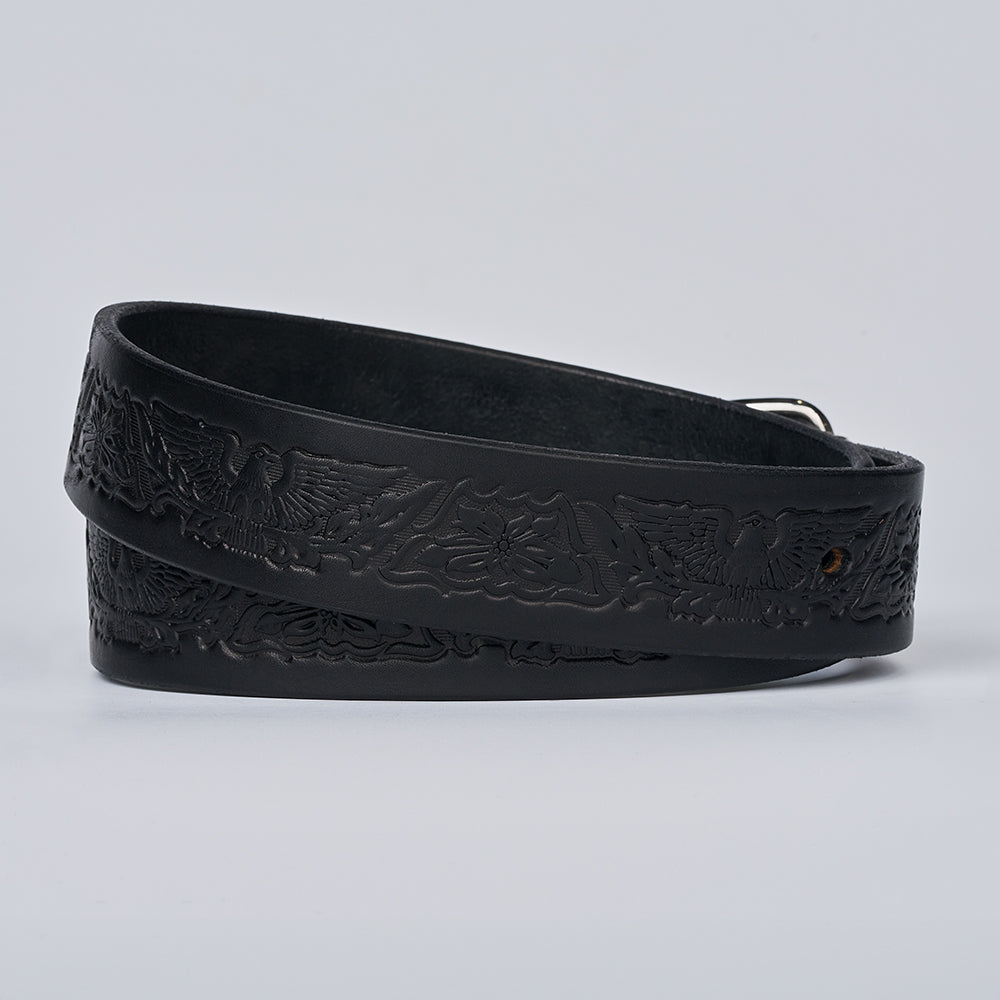 The Gunner Eagle by Hanks Belts is a black full-grain leather CCW gun belt, featuring embossed eagle and floral designs, coiled on a light gray background—blending style and strength for everyday use.