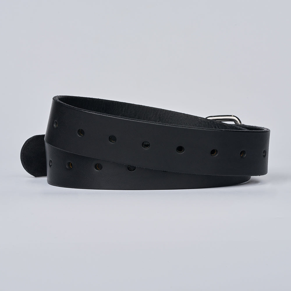 The Gunner Utility by Hanks Belts is a black leather belt with multiple holes, loosely coiled on a plain white background with its buckle partially visible.