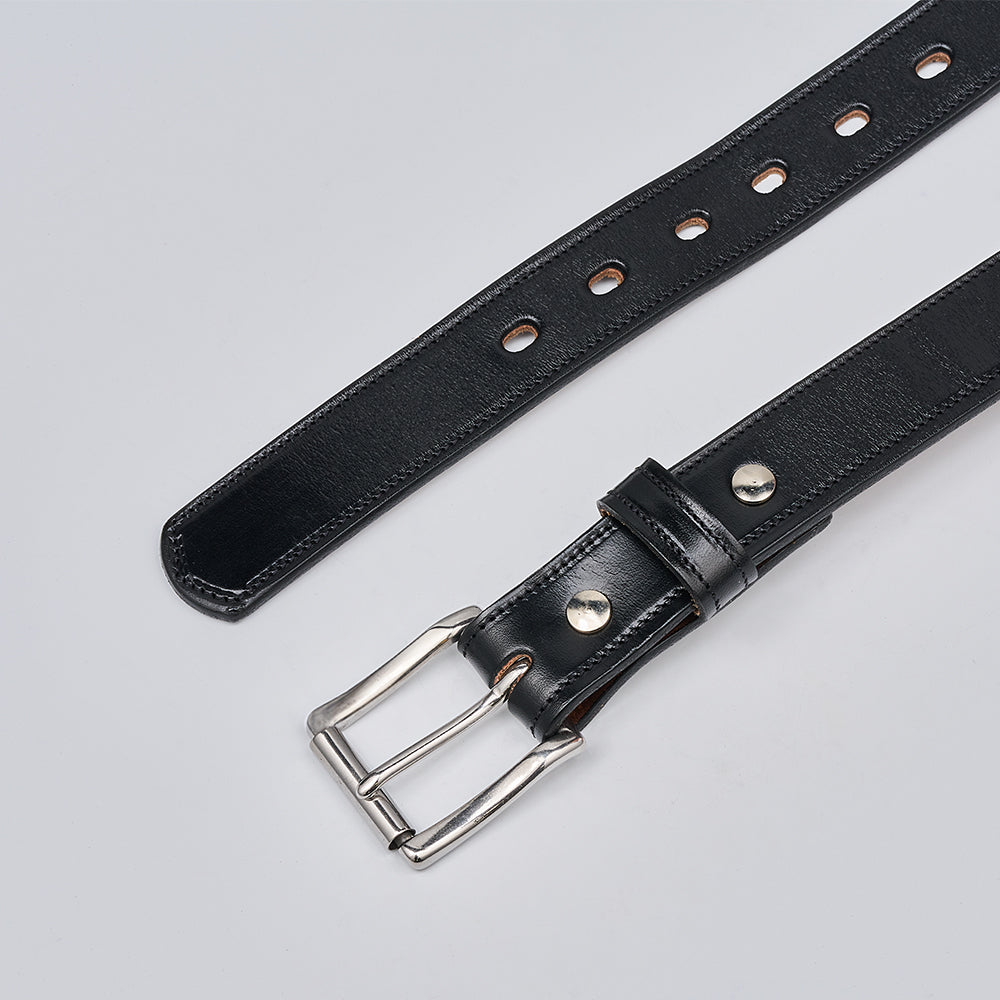 The Highland Lined by Hanks Belts is a premium black English bridle leather belt with a silver buckle and multiple metal eyelets, shown on a light gray background.
