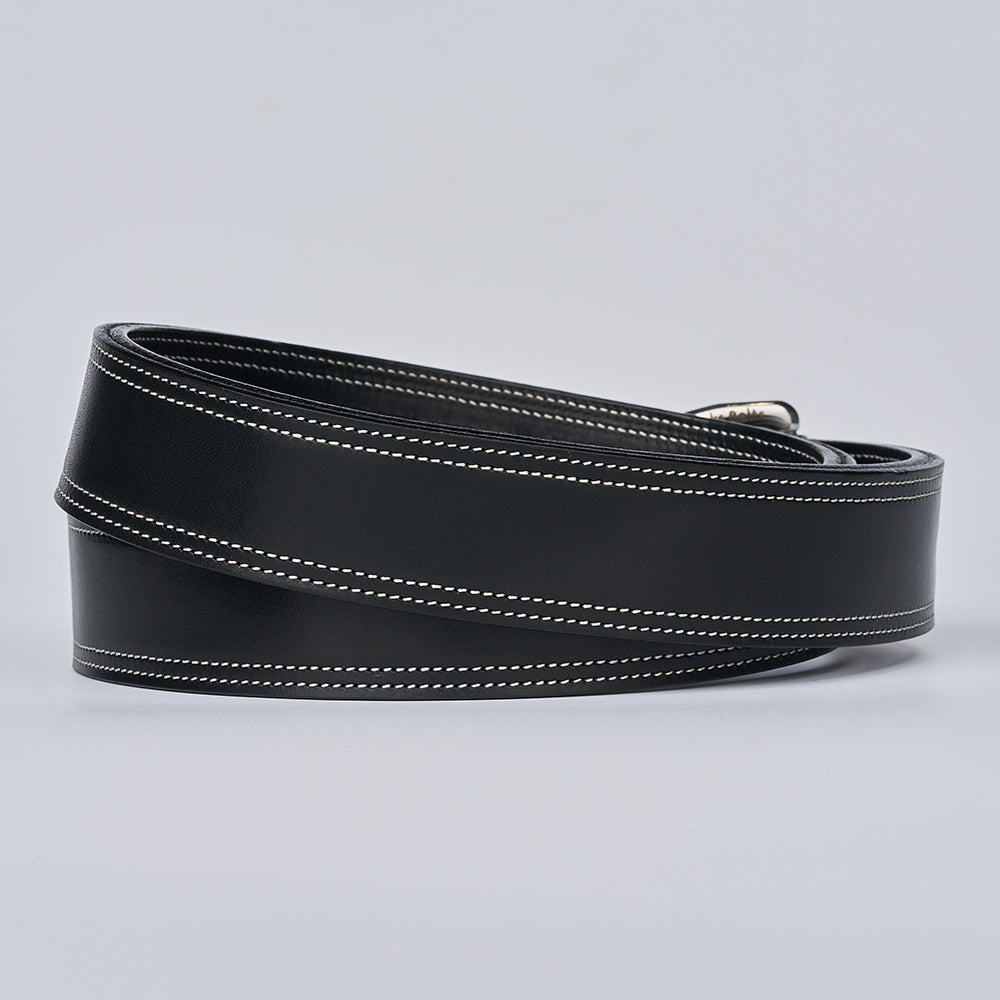 The Premier Double Layer by Hanks Belts is a coiled black vegetable-tanned leather English bridle belt with white edge stitching, displayed on a plain light grey background.