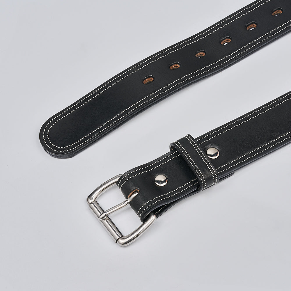 The Premier Double Layer by Hanks Belts is a black English bridle belt made from vegetable-tanned leather with white stitching, a silver buckle, multiple adjustment holes, and a belt loop, shown on a light gray background.