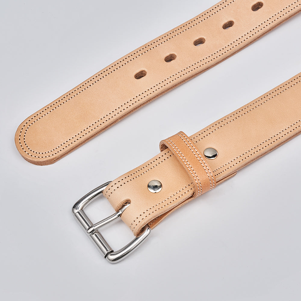 A close-up of The Premier Double Layer by Hanks Belts, an English bridle belt in light tan vegetable-tanned leather with a silver buckle and multiple adjustment holes, shown on a plain white background.