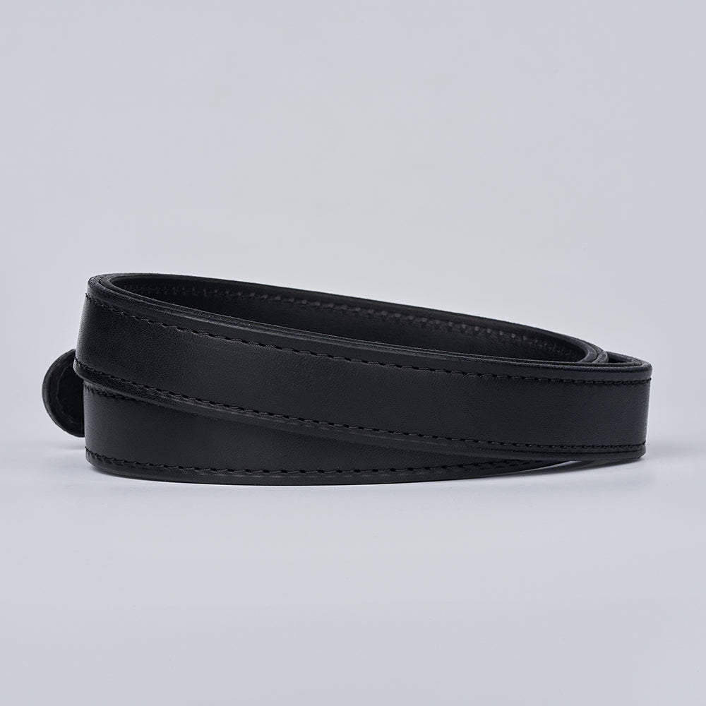 The Hanks Belts Steel Core - 1.25&quot; is a coiled black leather gun belt with neat stitching, designed for sturdy concealed carry, displayed on a plain light gray background.