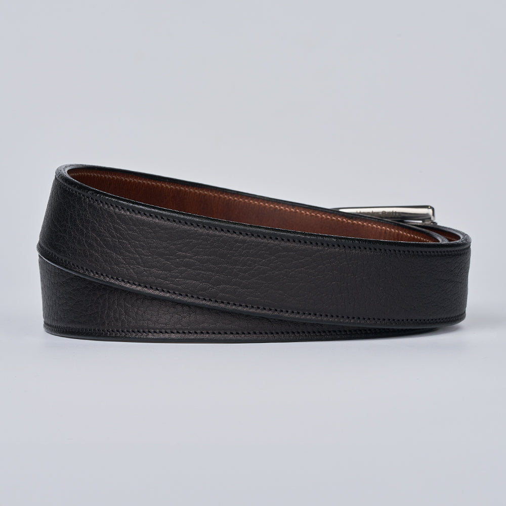Black leather belt with a silver buckle on a light gray background