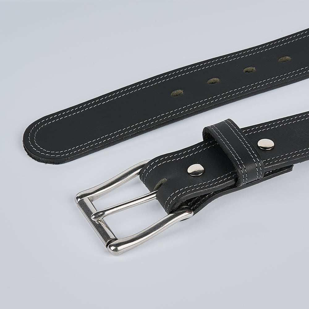 The Hanks Belts Wyoming Bison is a men's casual bison leather belt with white stitching, a silver buckle, multiple adjustment holes, and visible metal rivets, shown lying flat on a light gray background.