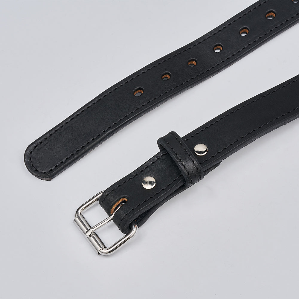 The Xtreme - 1.25&quot; black leather gun belt by Hanks Belts features a metal buckle, silver studs, multiple adjustment holes, and visible edge stitching, shown on a light gray background.
