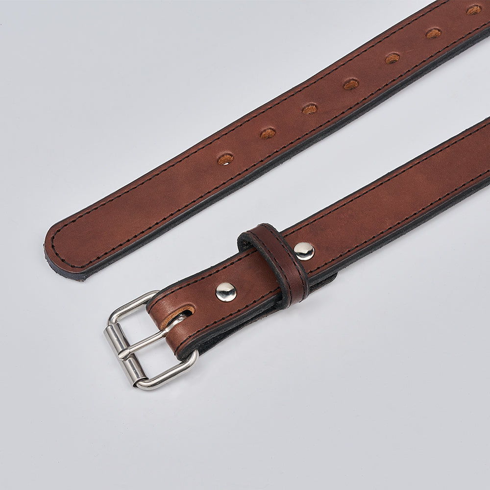 The Xtreme - 1.25&quot; by Hanks Belts is a brown leather gun belt with black edges and a silver buckle, shown flat on a light gray background. It has multiple adjustment holes and a loop, perfect for secure everyday or concealed carry.