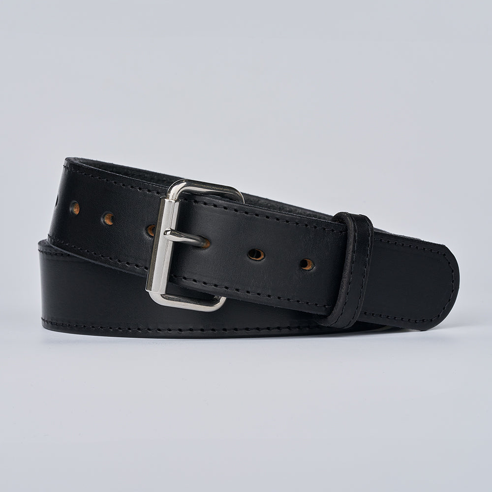 The Xtreme - 1.75&quot; by Hanks Belts, a heavy-duty leather belt with a silver buckle, is shown coiled loosely on a plain light gray background.