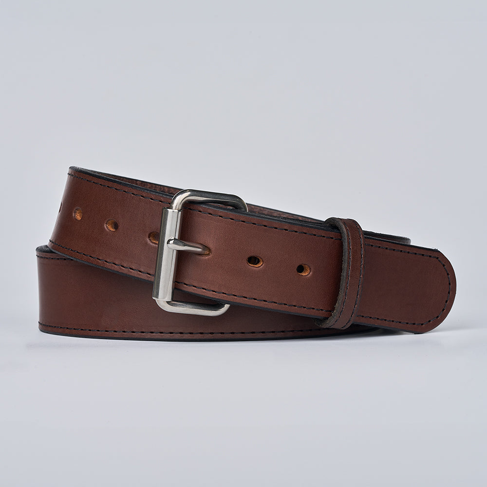 The Xtreme - 1.75&quot; by Hanks Belts is a heavy duty leather belt featuring a silver metal buckle, shown coiled neatly on a plain light gray background.