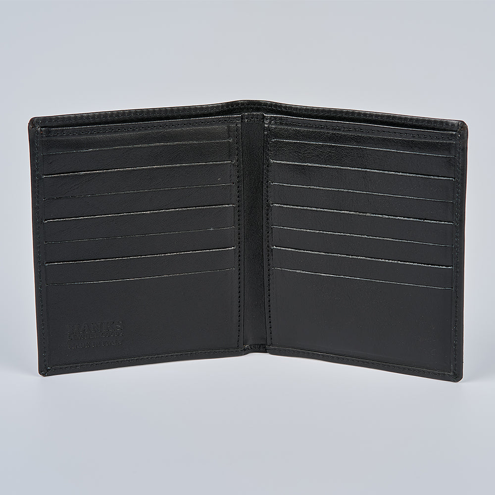 The Hanks Belts Iseo Italian Hipster Bifold, an open black full-grain leather wallet with multiple card slots on both sides, is displayed empty against a plain light background.