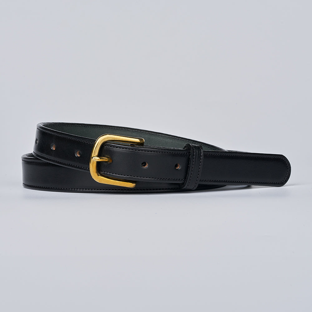 The Addyson - 1&quot; by Hanks Belts is a classic belt crafted from English Bridle Full-Grain Leather, featuring a shiny gold brass buckle and displayed coiled against a simple light gray background.