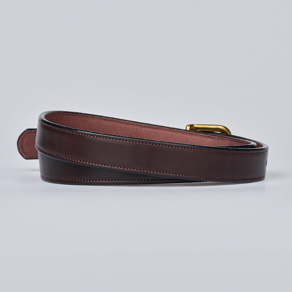 The Addyson - 1&quot; by Hanks Belts is a classic coiled leather belt crafted from dark brown English Bridle Full-Grain Leather with visible stitching and a brass buckle, displayed on a plain light background.