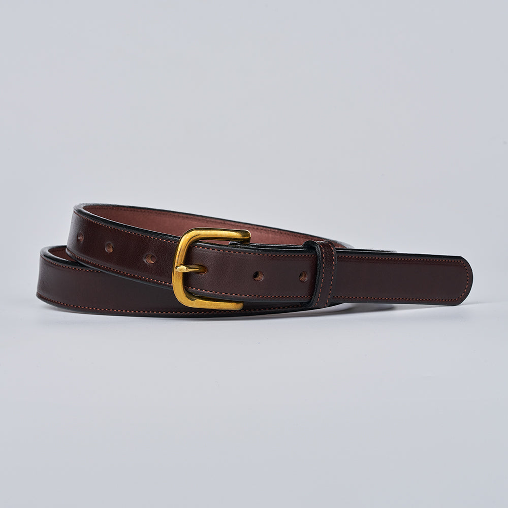 The Addyson - 1&quot; by Hanks Belts is a classic leather belt made from English Bridle Full-Grain Leather, featuring visible stitching and a shiny brass buckle, shown against a plain light gray background.