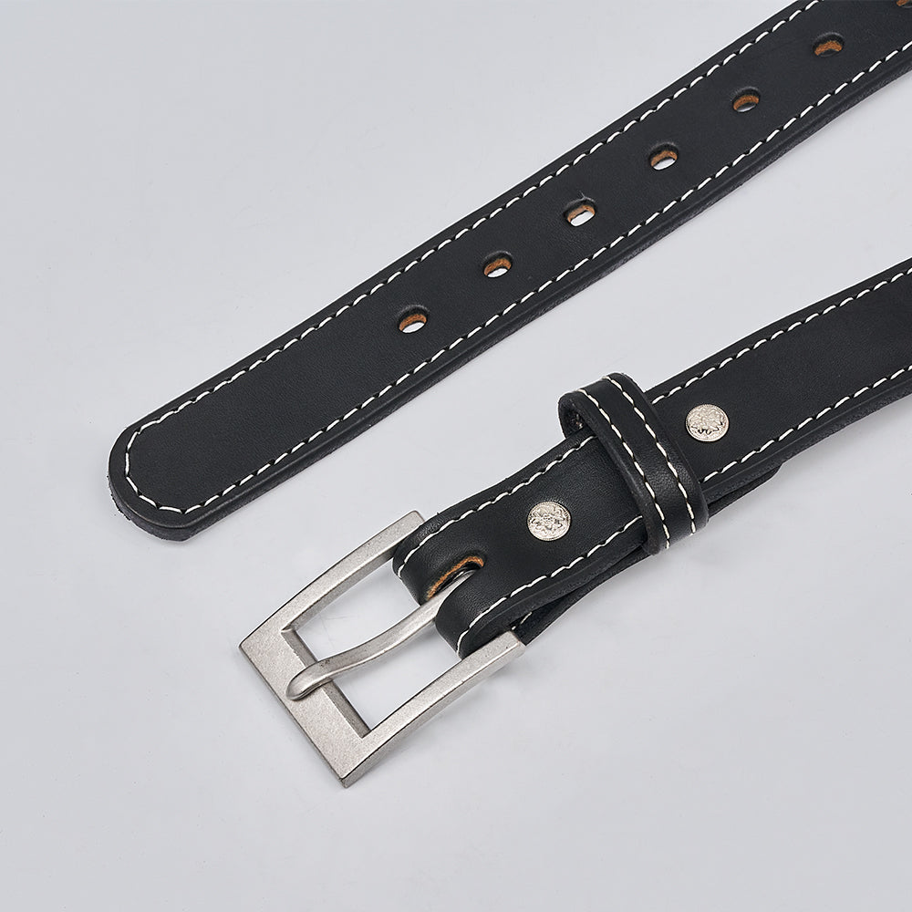 The Bonnie by Hanks Belts is a women&#39;s belt made from black full-grain leather with white stitching, a silver buckle, and multiple adjustment holes, shown on a light gray background.