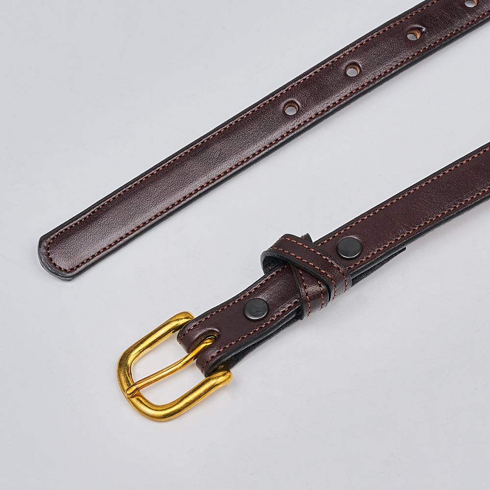 The Dixie by Hanks Belts: a brown English Bridle leather women&#39;s belt with white stitching, black metal rivets, and a gold-tone buckle, shown flat on a light gray surface. Expertly crafted in the USA.