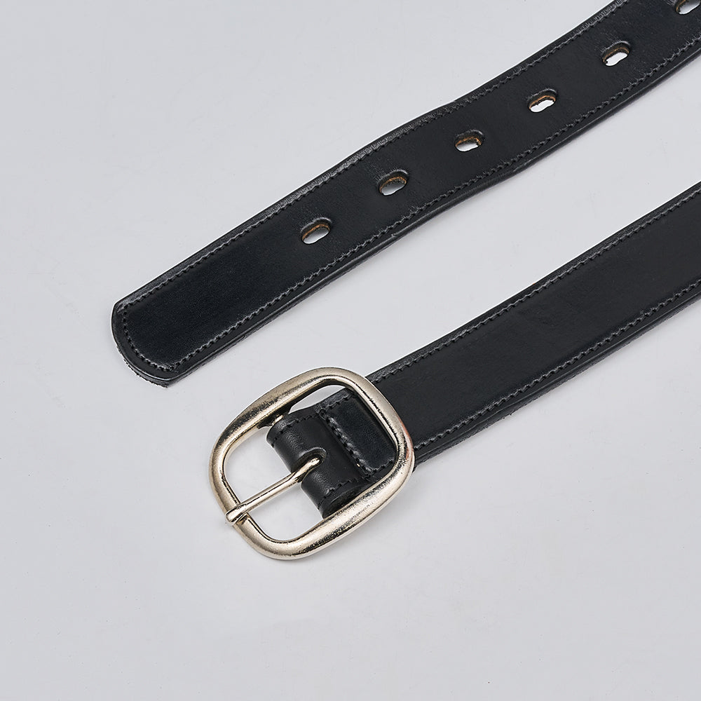 The Eloise by Hanks Belts is a women&#39;s belt made in the USA from vegetable-tanned leather. It features a silver rectangular buckle, multiple adjustment holes, and is shown on a light gray surface.