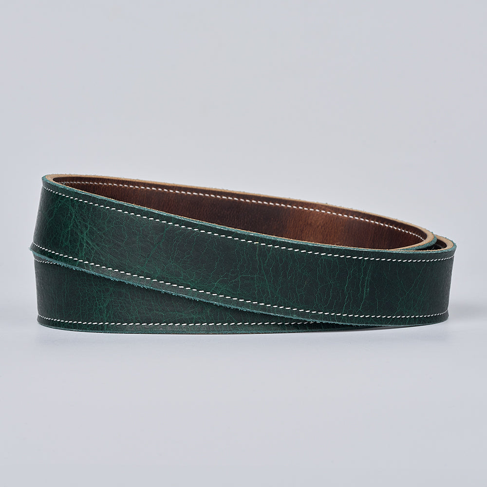 The Hanks Belts Ember - 1.25&quot; is a coiled dark green leather belt with white edge stitching, shown on a plain light gray background.