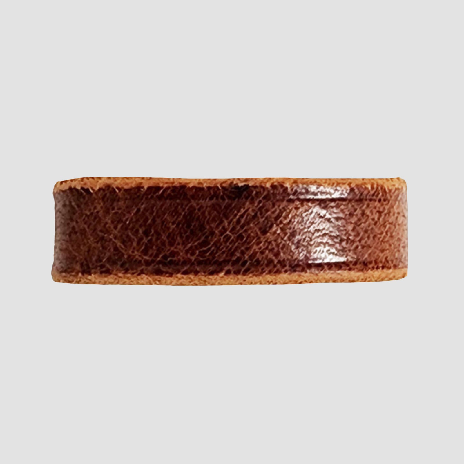 The Hanks Belts 1.5" Glazed #5 Keeper in Sunset Brown features a smooth, glossy finish and is displayed against a light gray background.