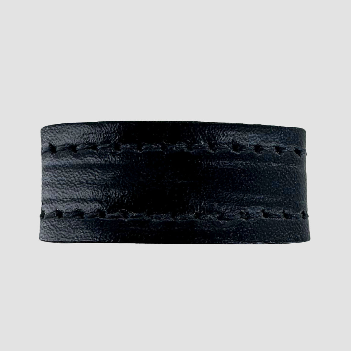 The Hanks Belts 1.25" Stitched #10 Keeper is a black leather ring with visible stitching along its top and bottom edges, resembling a sleek belt keeper, shown against a plain light gray background.