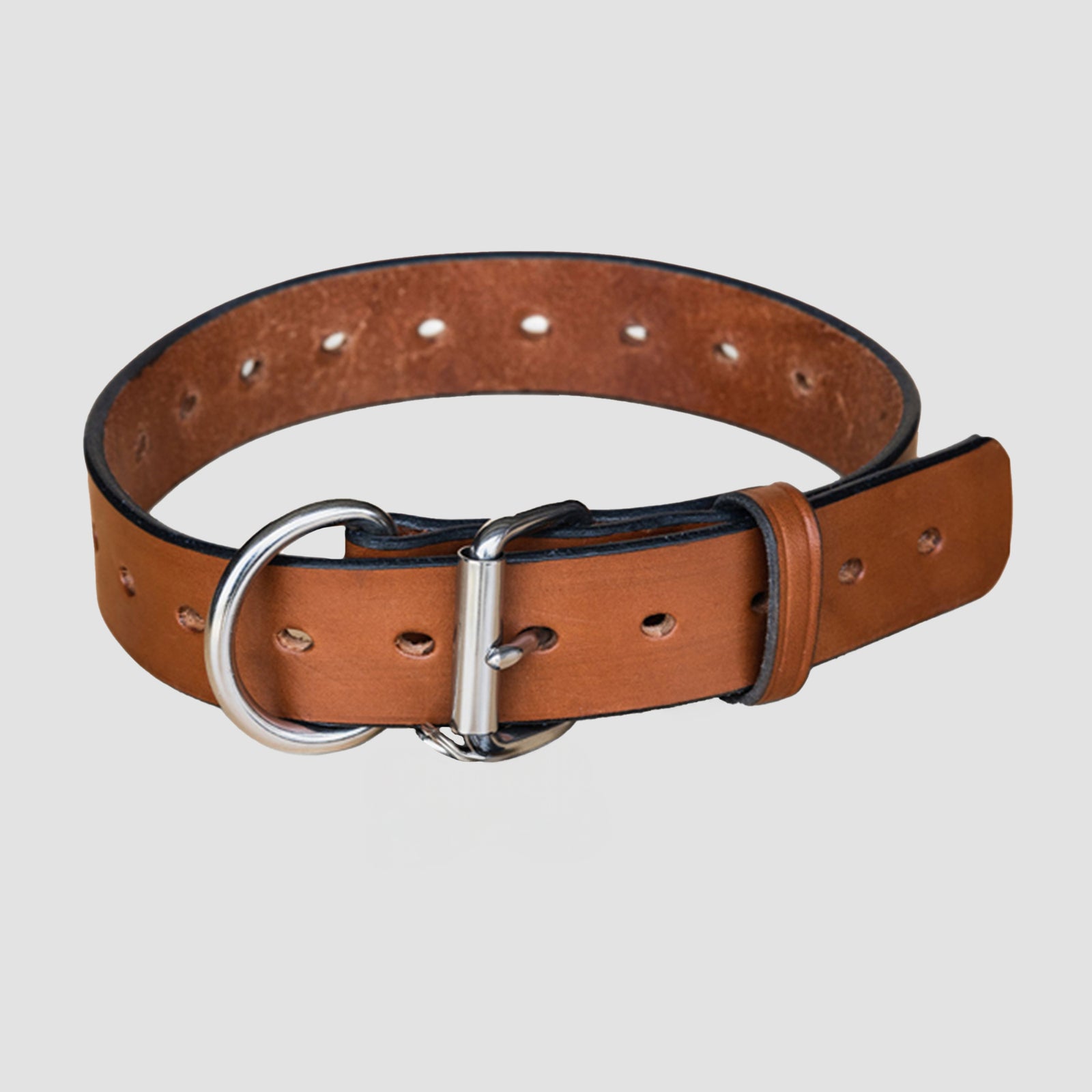 The Hanks Belts Big Ass Dog Collars for Big Ass Dogs in Oak color features a heavy-duty build with metal buckle, D-ring, and multiple adjustment holes, shown on a plain light background.