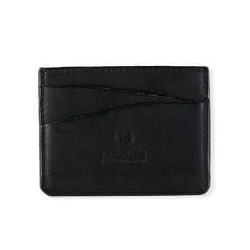 A black leather Cumberland Bison Card Holder from Hanks Belts, featuring the logo and text "Hanks Leather Goods" embossed in the center. Made from durable bison leather, it has two slanted card slots on the front with visible stitching along the edges.