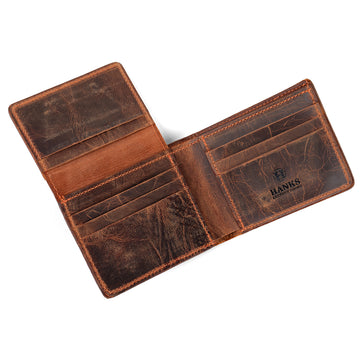 A well-worn Powell Bison Bifold wallet by Hanks Belts, crafted from brown bison leather, displays multiple card slots on both sides. "Hanks" is stamped inside on the right. The wallet lies flat against a white background, highlighting its ample storage options.