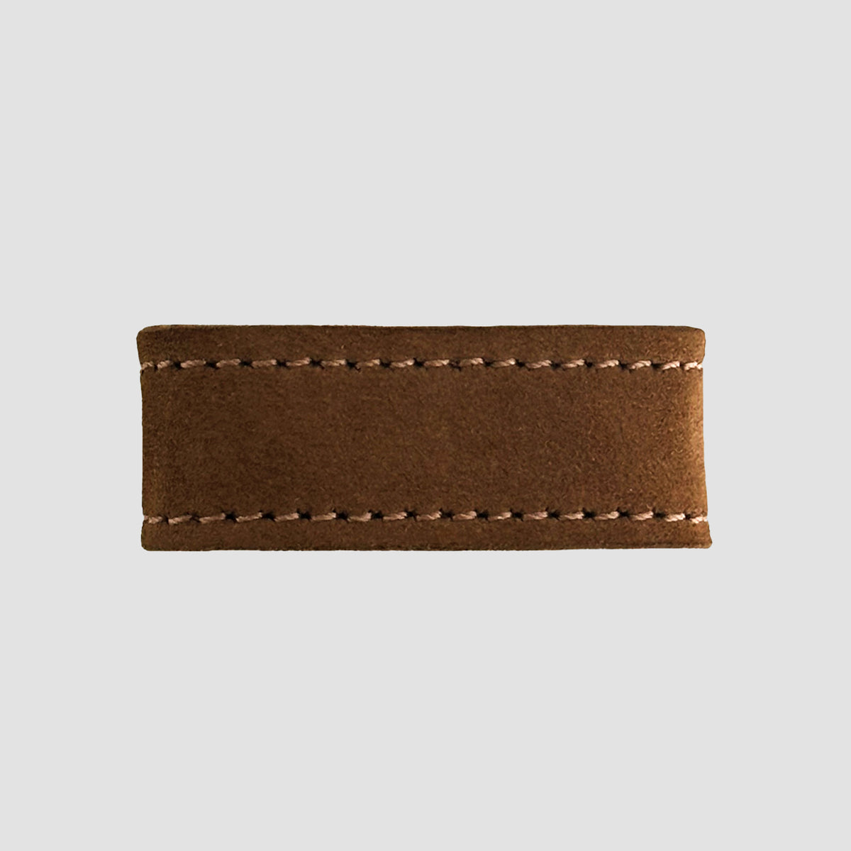The Hanks Belts 1.5" Suede #16 Keeper is a rectangular brown suede leather belt keeper with visible stitching on the top and bottom edges, displayed on a plain light gray background.
