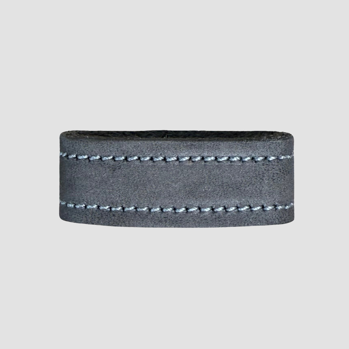 The Hanks Belts 1.5" Suede #16 Keeper is a wide gray suede ring featuring two parallel rows of white stitching across the band, shown against a plain light gray background.