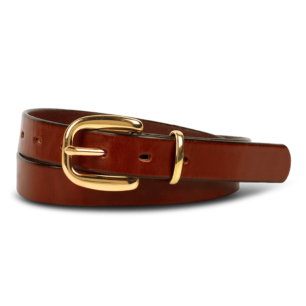 The Poppy - 1&quot; by Hanks Belts is a premium oak leather belt with a shiny gold buckle and loop, coiled neatly on a white background—an elegant and versatile addition to any wardrobe.