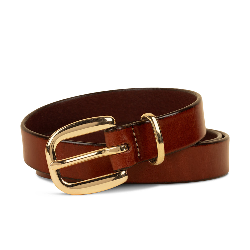 The Poppy - 1&quot; by Hanks Belts is a premium leather belt with a shiny gold buckle, coiled neatly on a white background—an elegant and versatile accessory for any wardrobe.