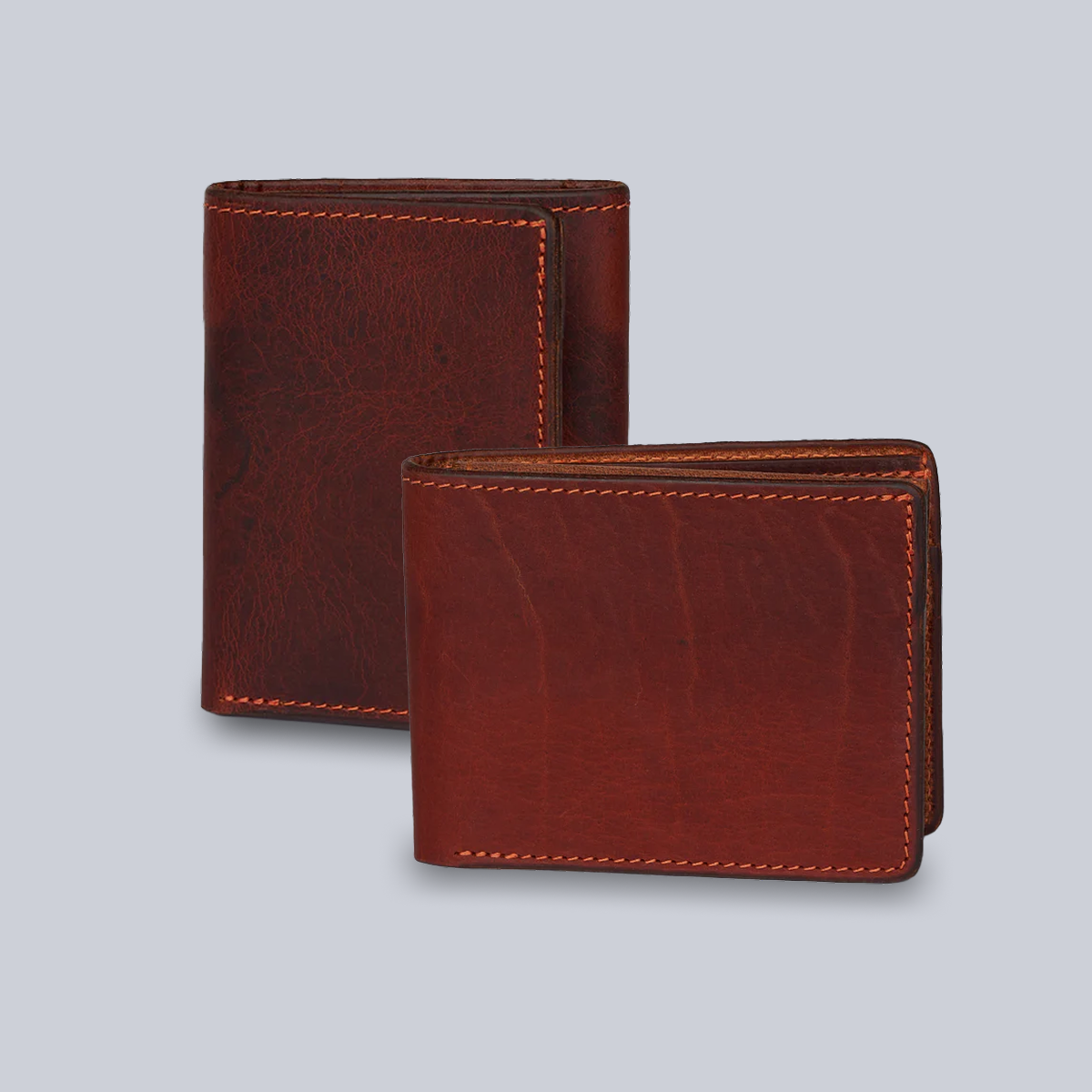 Two brown bison leather wallets, the Powell Bifold and Erie Trifold by Hanks Belts, are shown on a light gray background—one upright, one flat. Each luxury wallet is expertly handcrafted in the USA.