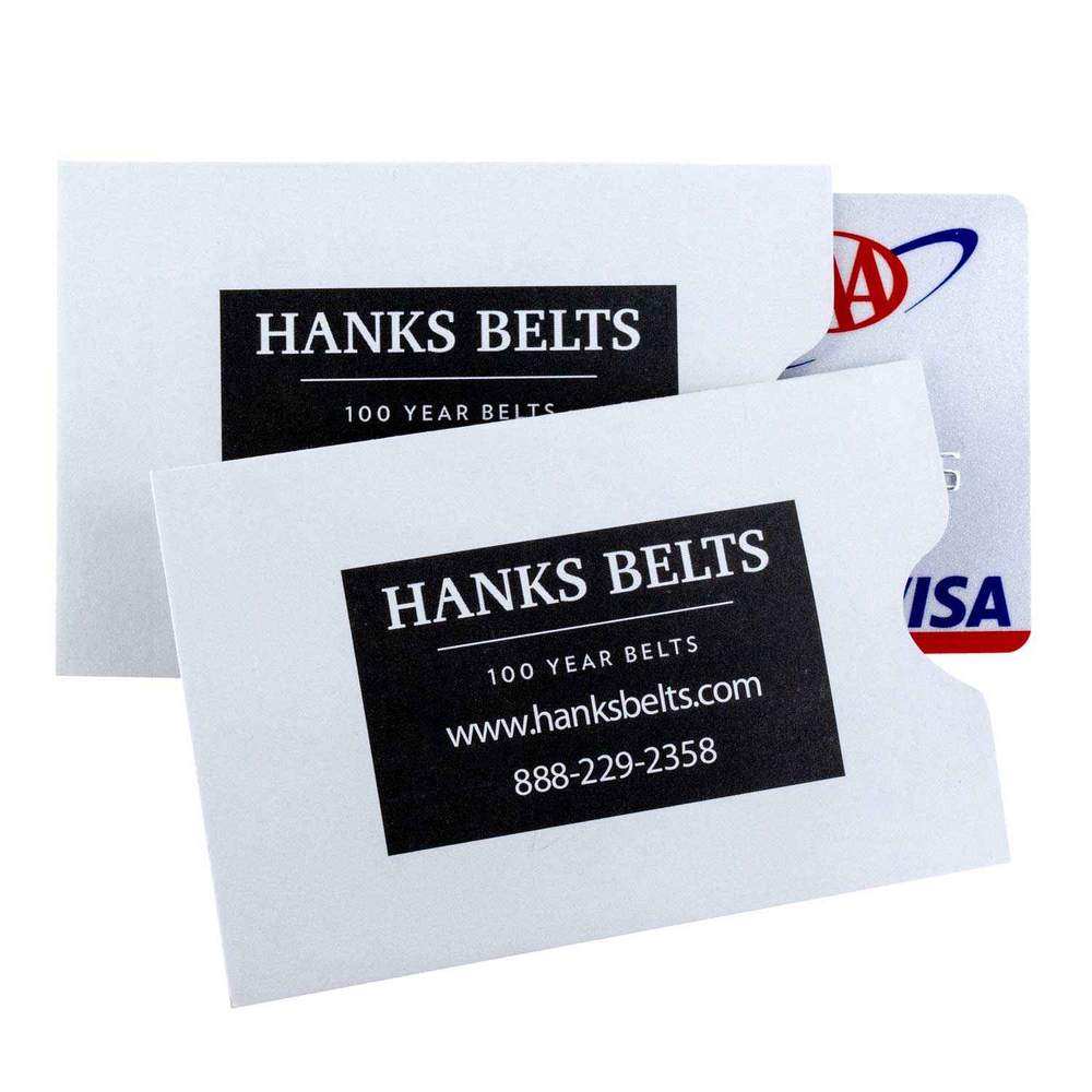 Two business cards from Hank Belts are displayed. Each card features the company’s name, the slogan "100 Year Belts," a website address (www.hanksbelts.com), and a phone number (888-229-2358). Behind the cards, a portion of a Visa card is visible, securely enclosed in RFID Shield Sleeves For Hanks Wallets - 4 Pack for credit card protection.